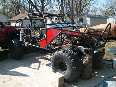 1986 Ford Bronco - This custom-built buggy, likely a project vehicle, features a prominent roll cage and large off-road tires, with visible Supermotors.net br…