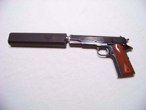 1995 Mercury Grand Marquis - A pistol with a suppressor is shown against a white background, with a watermark at the bottom.