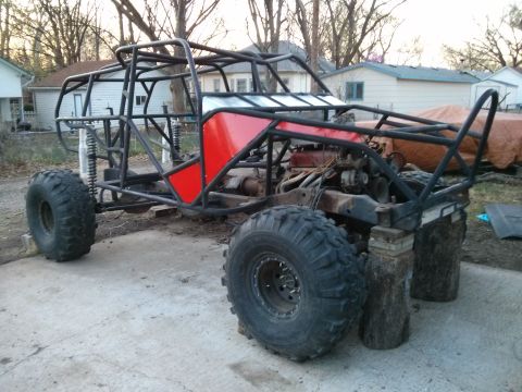 1986 Ford Bronco - This custom buggy is a tube-frame vehicle with large tires and a red body panel.