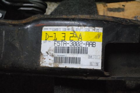 1986 Ford Bronco - A label on a vehicle component displays part number F5TA-3002-AAB and a serial number.