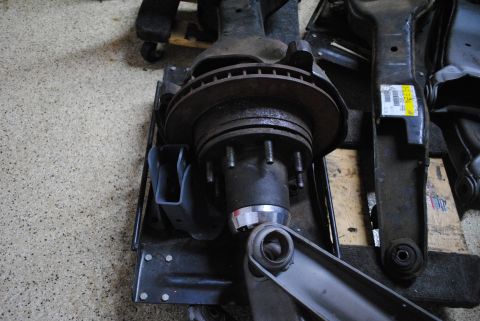 1986 Ford Bronco - Close-up of a Dana 50 TTB front axle assembly, the brake rotor and hub.