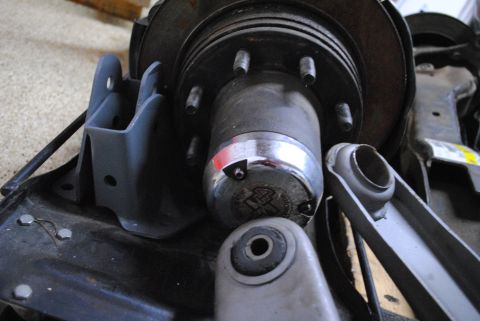 1986 Ford Bronco - Close-up of a Dana 50 TTB front axle hub and suspension parts.