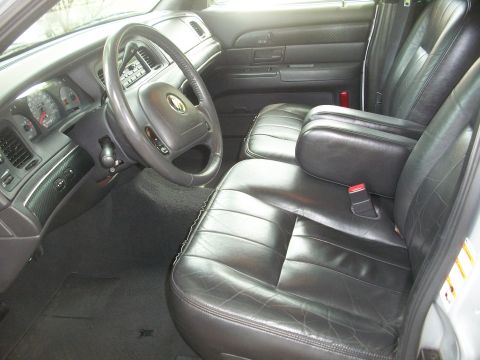 2003 Mercury Grand Marquis - The interior of a 2003 Mercury Grand Marquis, leather seats and a full dashboard view.