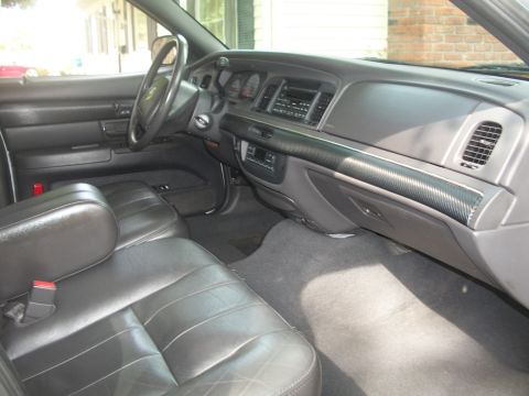 2003 Mercury Grand Marquis - Interior view of a 2003 Mercury Grand Marquis, showing the front seats and dashboard.