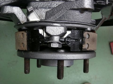 close-up of car brake drum assembly with brake shoes