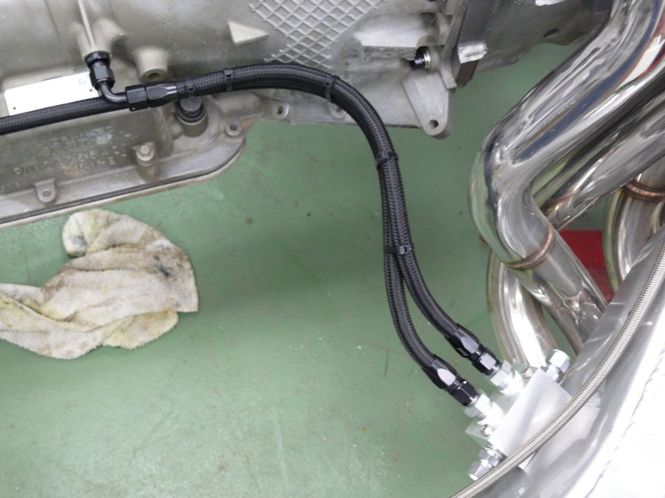 engine block with braided hoses and exhaust manifold