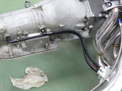 Transmission housing with braided lines and chrome exhaust headers