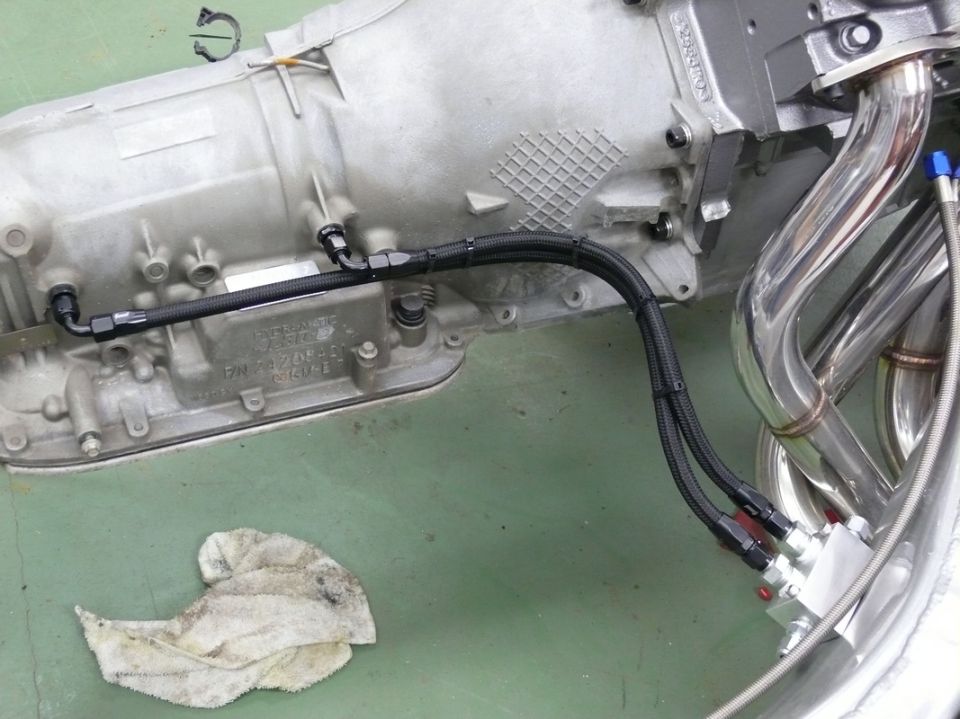 Transmission housing with braided lines and chrome exhaust headers