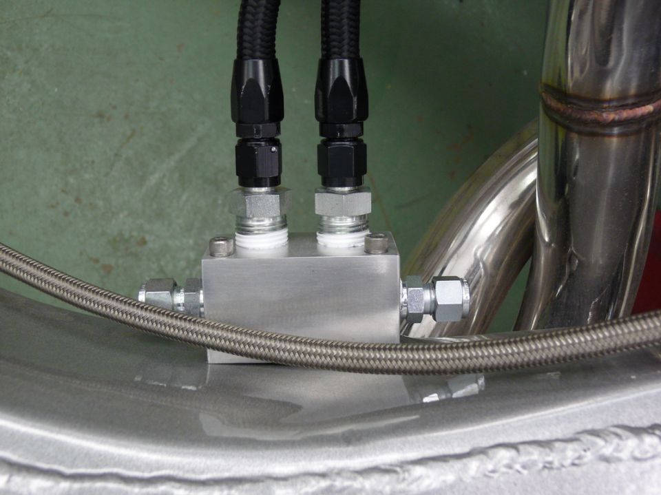 fuel line manifold with braided hoses and stainless steel exhaust pipes