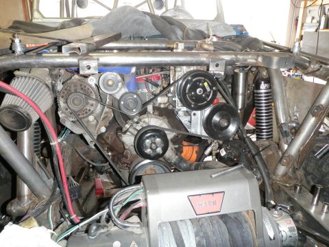 1961 International Scout 800 - Close-up view of a modified engine bay, showing various components and a WARN winch.