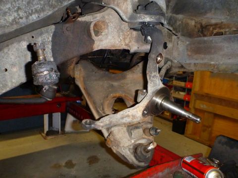 1964 Mercury Monterey - Front suspension components, including ball joints and spindle, are visible in this close-up.