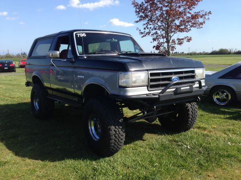 1989 Ford Bronco - Modified 1989 Ford Bronco on display, showing its lifted suspension and custom front bumper.