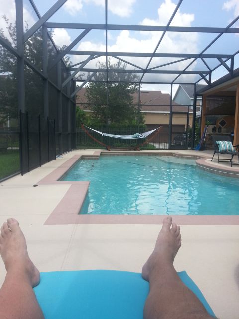 1994 Ford Bronco - Relaxing by the pool on a sunny day, with a hammock and lounge chair visible.