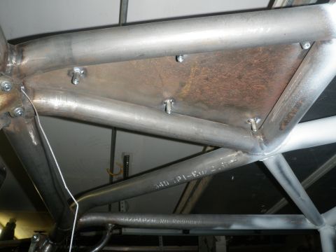 1961 International Scout 800 - Close-up view of a custom roll cage structure, showing welded tubing and stamped part numbers.