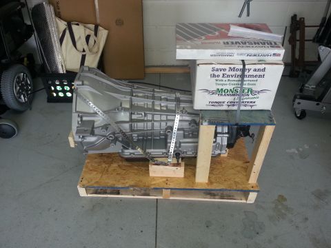 1994 Ford Bronco - A rebuilt transmission and torque converter are packaged for shipping, with product information visible on the boxes.
