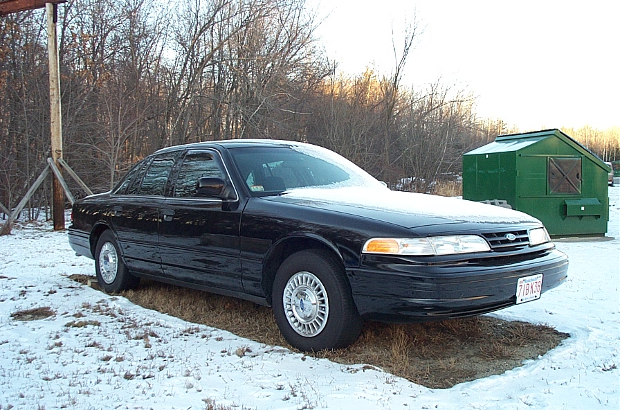 Black 1991 Ford Crown Victoria LTD sedan parked in snow