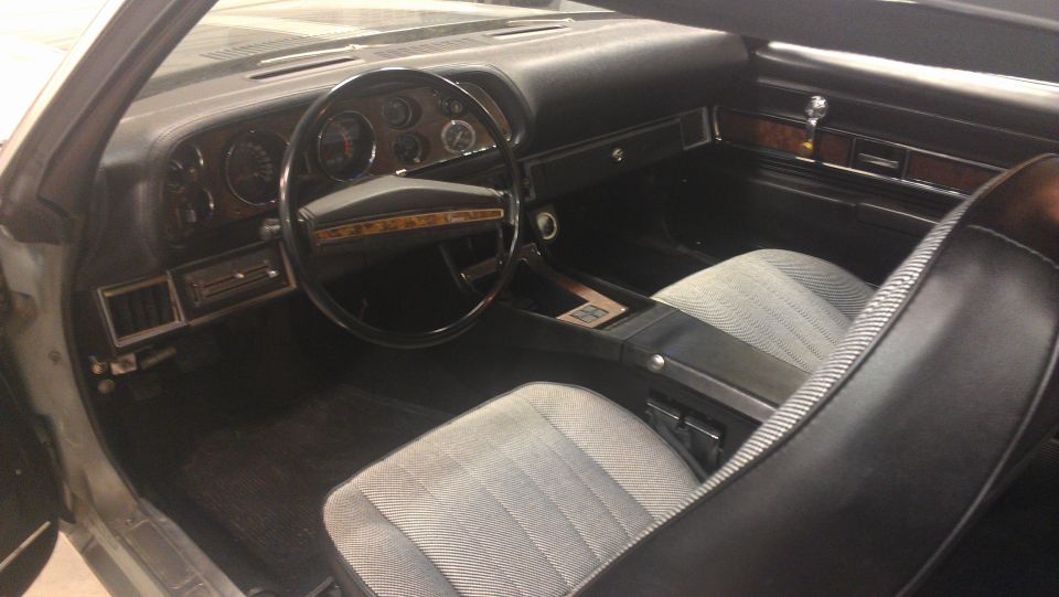 1976 Pontiac Trans Am interior with wood trim and patterned seats