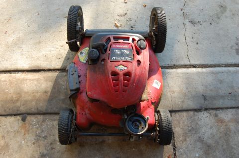 2006 Honda RANCHER - A red Troy-Bilt lawn mower is shown from above, a 21-inch cut and a 6.75 horsepower engine.