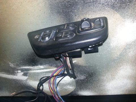 1994 Ford Bronco - This is a power window and lock switch assembly with multiple wires connected.