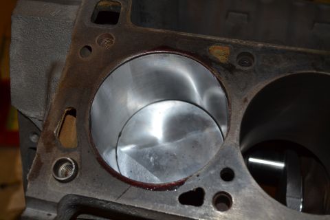 1981 Ford F-250 - Close-up view of an engine block's cylinder bores, showing honing marks and residue from a reassembly process.