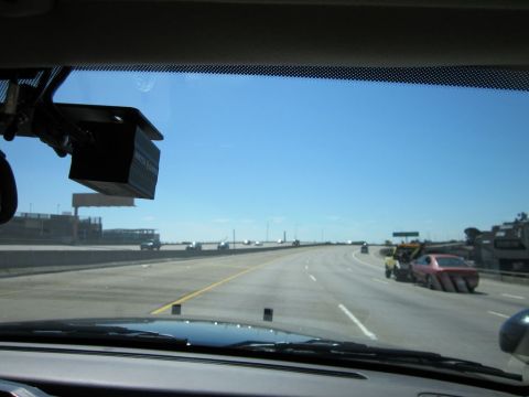 1991 Ford LTD Crown Victoria - Driving on a highway, observing a tow truck assisting a pink car.