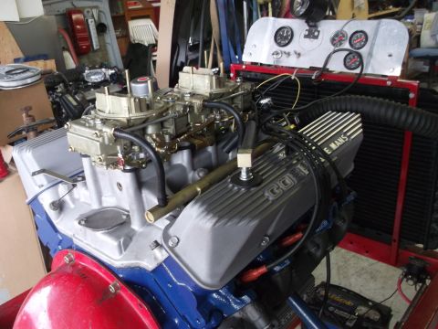 1967 Ford Mustang - Engine on a test stand with dual carburetors, radiator, and gauges. "LE MANS" valve cover is visible.