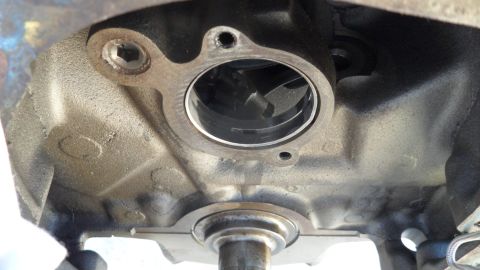 1972 Ford Ranchero - Close-up view of an engine block's water pump housing, revealing internal components.