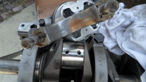 1972 Ford Ranchero - Close-up view of an engine's crankshaft and connecting rod assembly, highlighting worn bearing surfaces.
