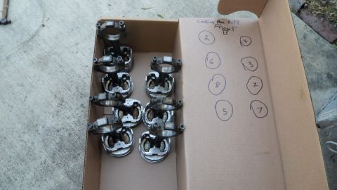 1972 Ford Ranchero - Eight pistons and connecting rods are organized in a box, with cylinder numbers marked on the lid.