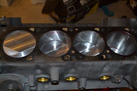 1981 Ford F-250 - Close-up view of an engine cylinder head, showing the bores of four cylinders with visible machining marks.