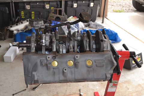1981 Ford F-250 - Engine block assembly on a stand, showing the crankshaft and connecting rods.