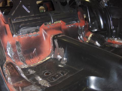 1970 Chevrolet Camaro - The interior floor pan of a car shows signs of rust repair and welding.