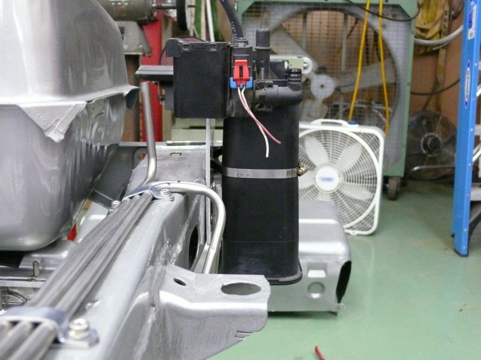 fuel tank and emissions canister assembly