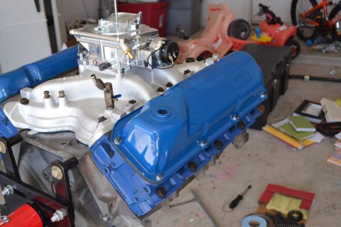 1981 Ford F-250 - A Ford V8 engine, likely from a truck, is shown with blue valve covers and a prominent carburetor.