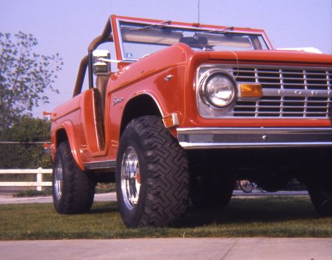 1996 Ford Bronco - This red Ford Bronco has a distinctive body style and chrome wheels.
