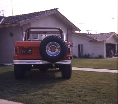1996 Ford Bronco - Rear view of a red Ford Bronco with a spare tire and California license plate.