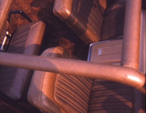 1996 Ford Bronco - Interior view of vehicle seats and roll bar.