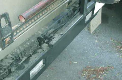 1990 Ford Bronco II - Crude, cheap, and effective. A small spring keeps the gate-latch lever from bouncing open. Another small stiff spring keeps pressure agains…