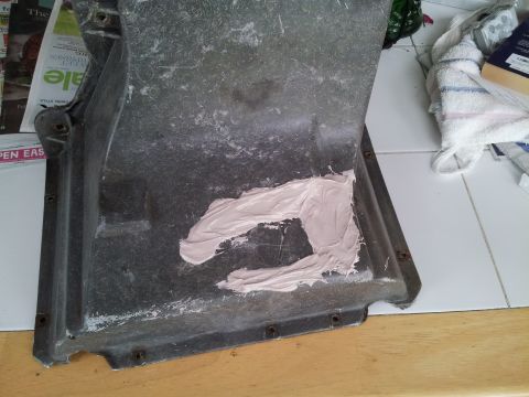 1976 Ford Ranchero - A close-up view of an air conditioning duct that has been repaired with body filler.