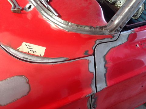 1964 Ford Fairlane - Car body repair in progress, showing metalwork and a handwritten note on the panel.