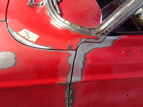 1964 Ford Fairlane - Car body undergoing repair, showing areas of welding and preparation for paint.