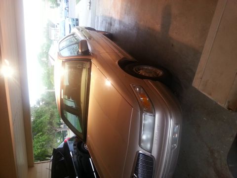 1997 Mercury Grand Marquis - This 1997 Mercury Grand Marquis is parked inside a garage, showing its front quarter view.