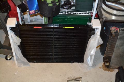 1981 Ford F-250 - A new radiator is shown, packaged and ready for installation, beside an older, used radiator.