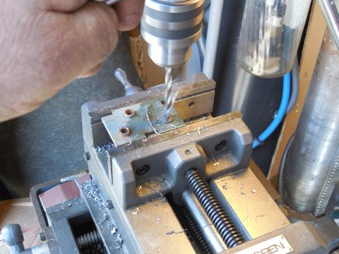 1983 Ford Bronco - Grind the broken bolt flat & flush with the nut plate on both sides, center punch it, and drill 5/16".