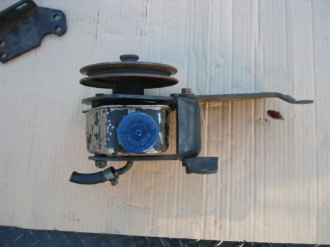 1973 Ford F-100 - Power steering pump assembly with pulley and bracket. Blue cap is visible on the reservoir.