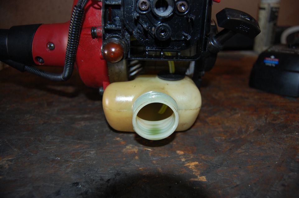 Fuel tank and engine of a red power tool