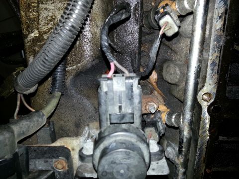 1994 Ford Bronco - Engine component with electrical connectors and wiring harness visible.