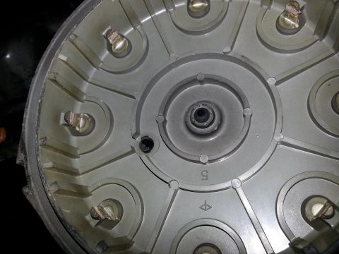 1994 Ford Bronco - Close-up of a vehicle's distributor cap, a component of the ignition system.