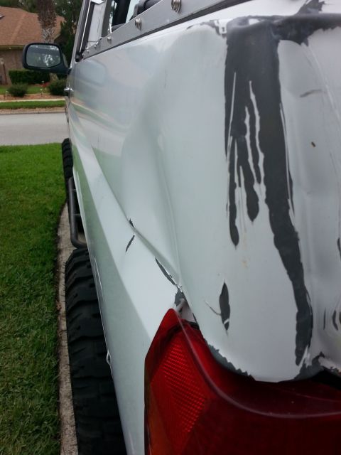 1992 Ford Bronco - this dent along the side will be a lot easier to pull.