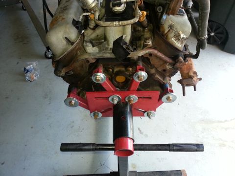 1994 Ford Bronco - Engine assembly mounted on a red engine stand, ready for work or transport.